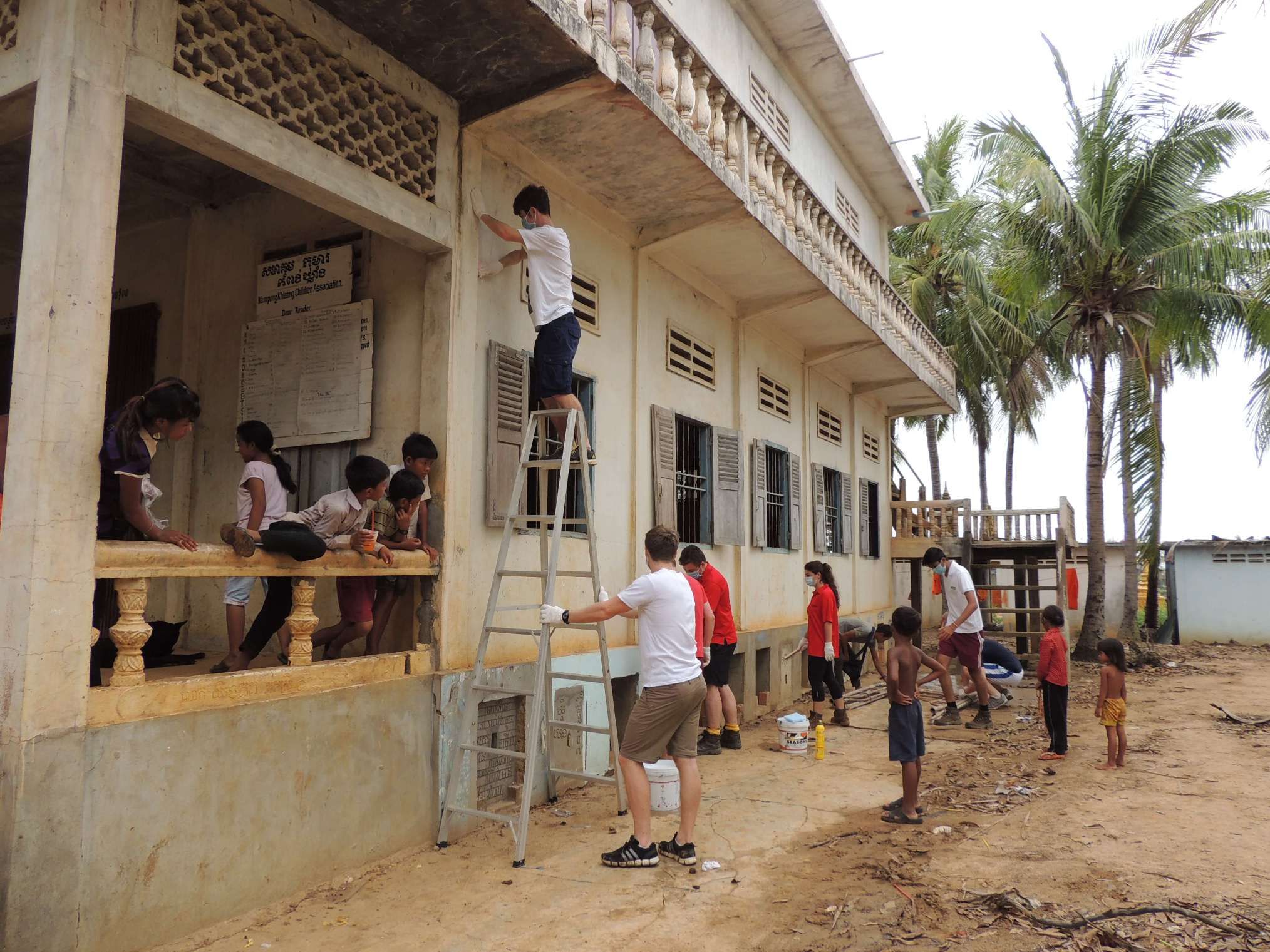 University students painting school